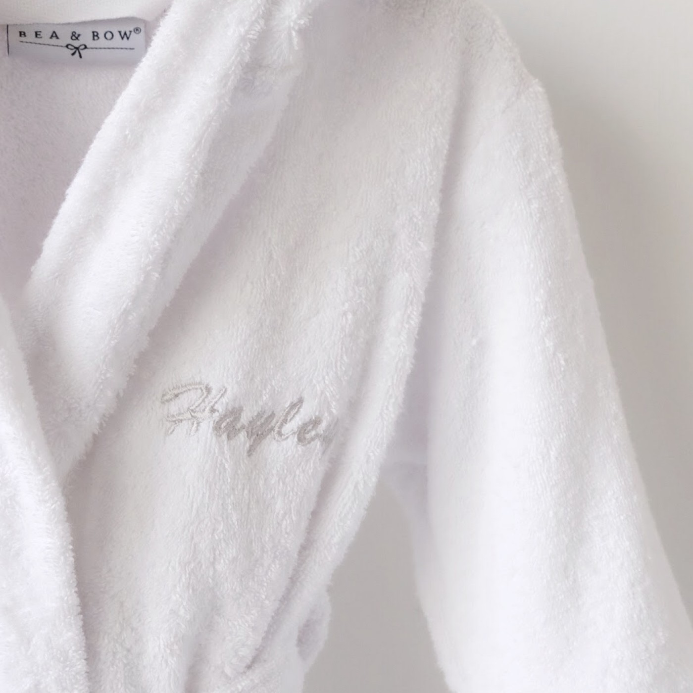 white hooded towelling bathrobe